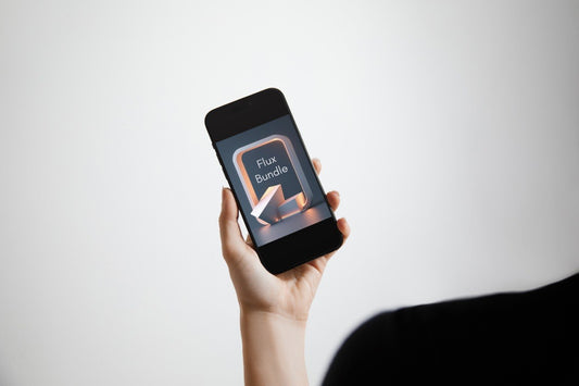 A hand holding a black smartphone against a light gray background, with the phone screen displaying the Halo System logo.