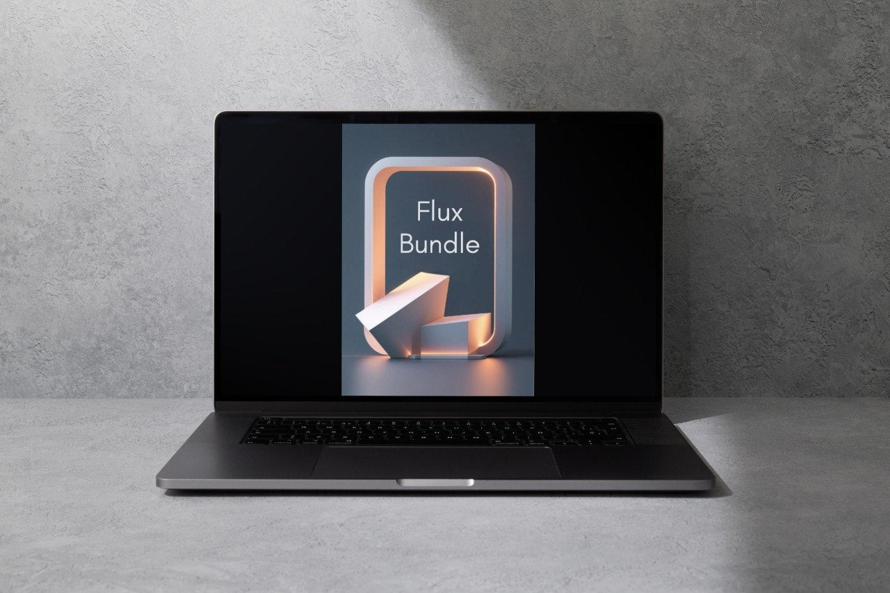 A dark gray laptop sits open on a light gray surface against a textured gray wall, with the screen displaying a graphic that reads 'Flux Bundle'.